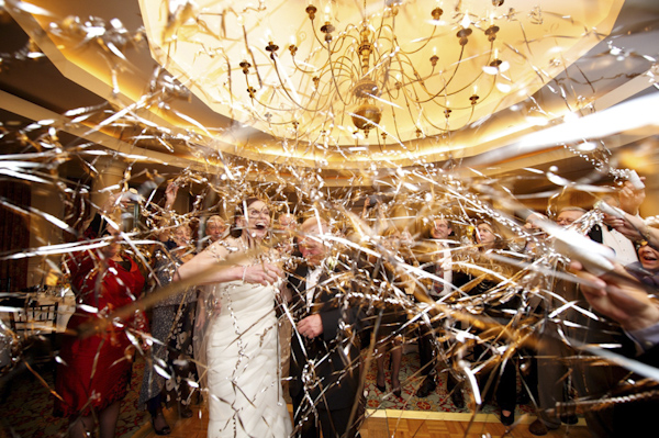celebration exit photo with streamers - wedding photo by top Atlanta-based wedding photographer Scott Hopkins Photography